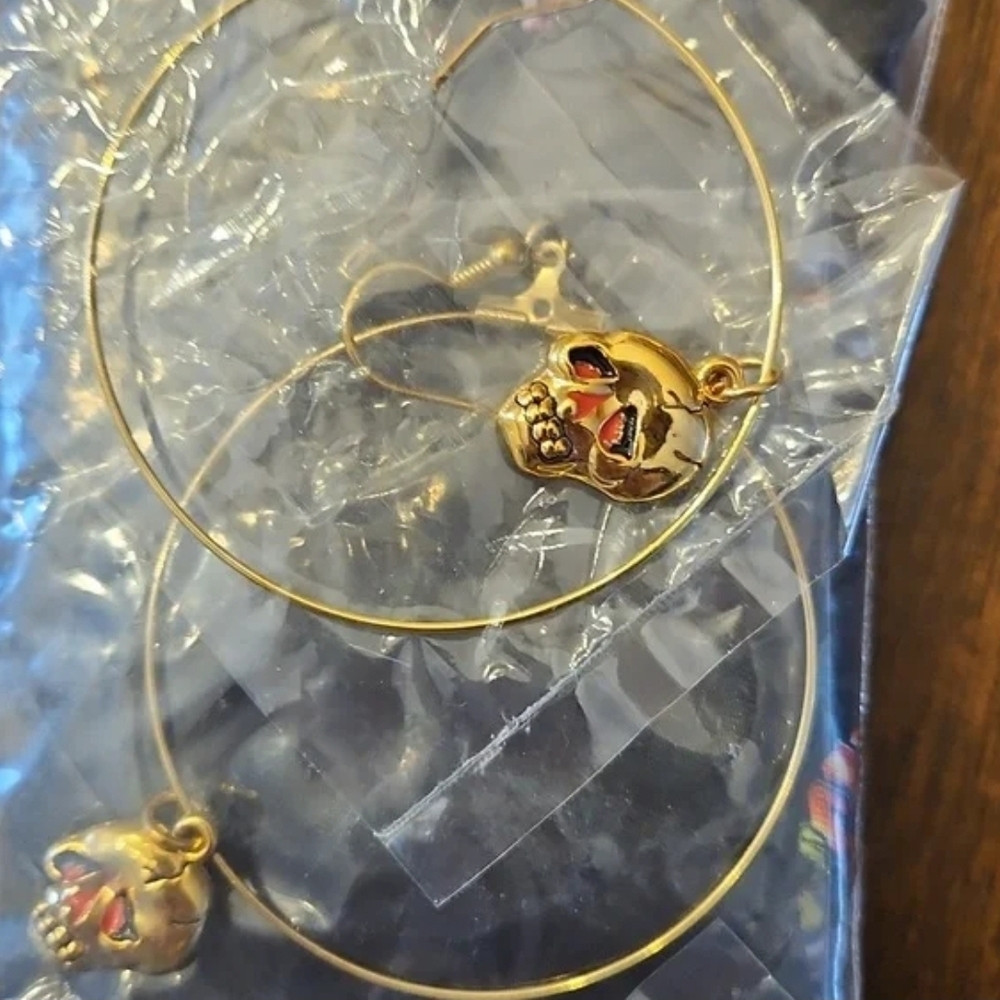 Ed Hardy Gold Hoop Earrings with Red-Accented Skull Charms
